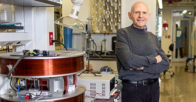 Samuel Stupp posing in his research lab