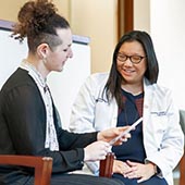 Sumanas Jordan with a patient